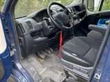 an image of a blue truck with the door open