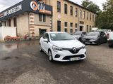 a white car parked in front of a building