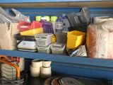 a blue shelf with many items on it in a room