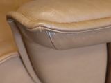 a brown leather reclining chair with a brown foot rest