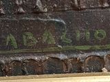 a close up of a sign on a brick wall
