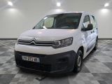 the white van is parked on a checkered floor in a room