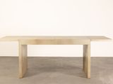 the table is made of wood and has a rectangular top