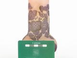 a small vase that has a credit card in front of it