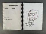 drawing of a woman ' s face in a notebook with a pen