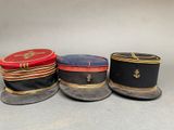 three hats are lined up on top of each other on a table
