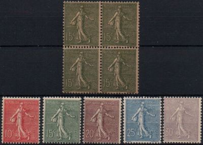 a close up of a group of stamps on a black surface