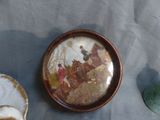 a plate with a picture of a man riding a horse on it
