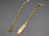 a gold plated bracelet with a long chain and a clasp