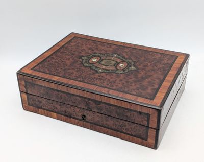 an image of a wooden box with a decorative design on the lid