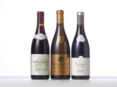 three bottles of wine sitting on top of a table next to each other