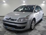a picture of a silver citrole parked in a showroom