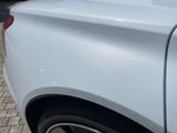 a close up of a car ' s rear end with a sticker on it