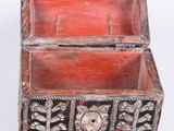 an old wooden box with metal decorations on it on a white background