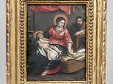 une image représentant un tableau où l'on voit une femme tenant un bébé dans un panier