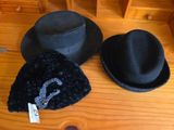 two hats and a hat tag on a wooden table