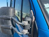 an image of a blue truck with a side view mirror