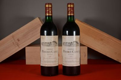 two bottles of wine sitting next to each other on a table