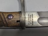 a close up of a knife with a metal handle
