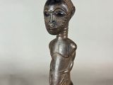 an image of a statue of a person with a hat on