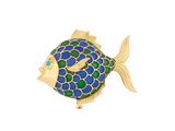 a close up of a fish shaped brooch with blue, green, and yellow colors
