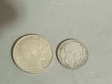 two coins sitting next to each other on a table