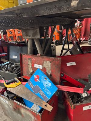 a lot of tools that are sitting under a table