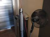 an image of a room with a fan and a radiator