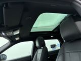 a view of the sunroof from inside of a car