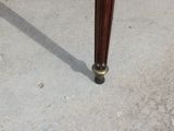 a close up of a wooden table with a glass top