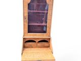 an old wooden dresser with a mirror on top of it