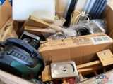 a cardboard box filled with assorted items in a room