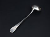 a close up of a spoon on a black surface