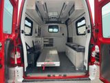 a red van with a table in the back of it