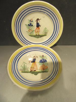 pair of yellow and blue plates with a girl and a dog