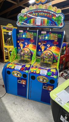 two arcade machines that are sitting in a room