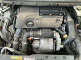 a picture of a car engine with its hood open
