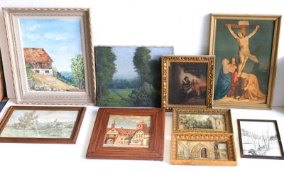 many framed pictures and paintings on the table