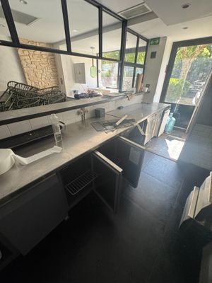 a bathroom with a sink and a mirror in it