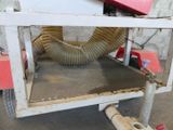 a machine that has a hose attached to the back of it
