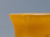 a close up of a glass of beer on a table
