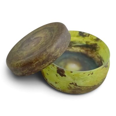a banana that is sitting in a bowl on a table