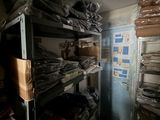 a room filled with lots of boxes and shelves