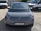 a grey car that is parked in a parking lot