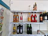 many bottles of alcohol on the shelves in the store