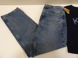 a pair of jeans and a t - shirt sitting on a table