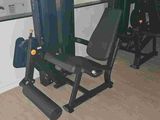 an image of a home gym room with equipment in it