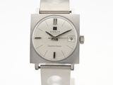 a close up of a wrist watch on a white surface
