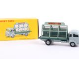 a toy truck with a box on the back of it