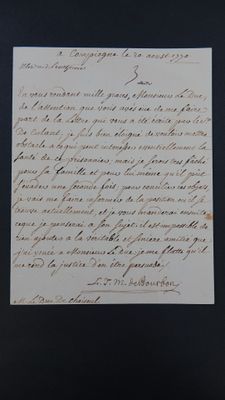 une vieille lettre écrite en cursive sur un bout de papier